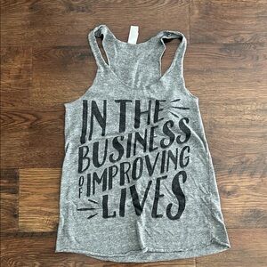 In the Business of Improving Lives Tank Top | Graphic Tee | Graphic Tank Top